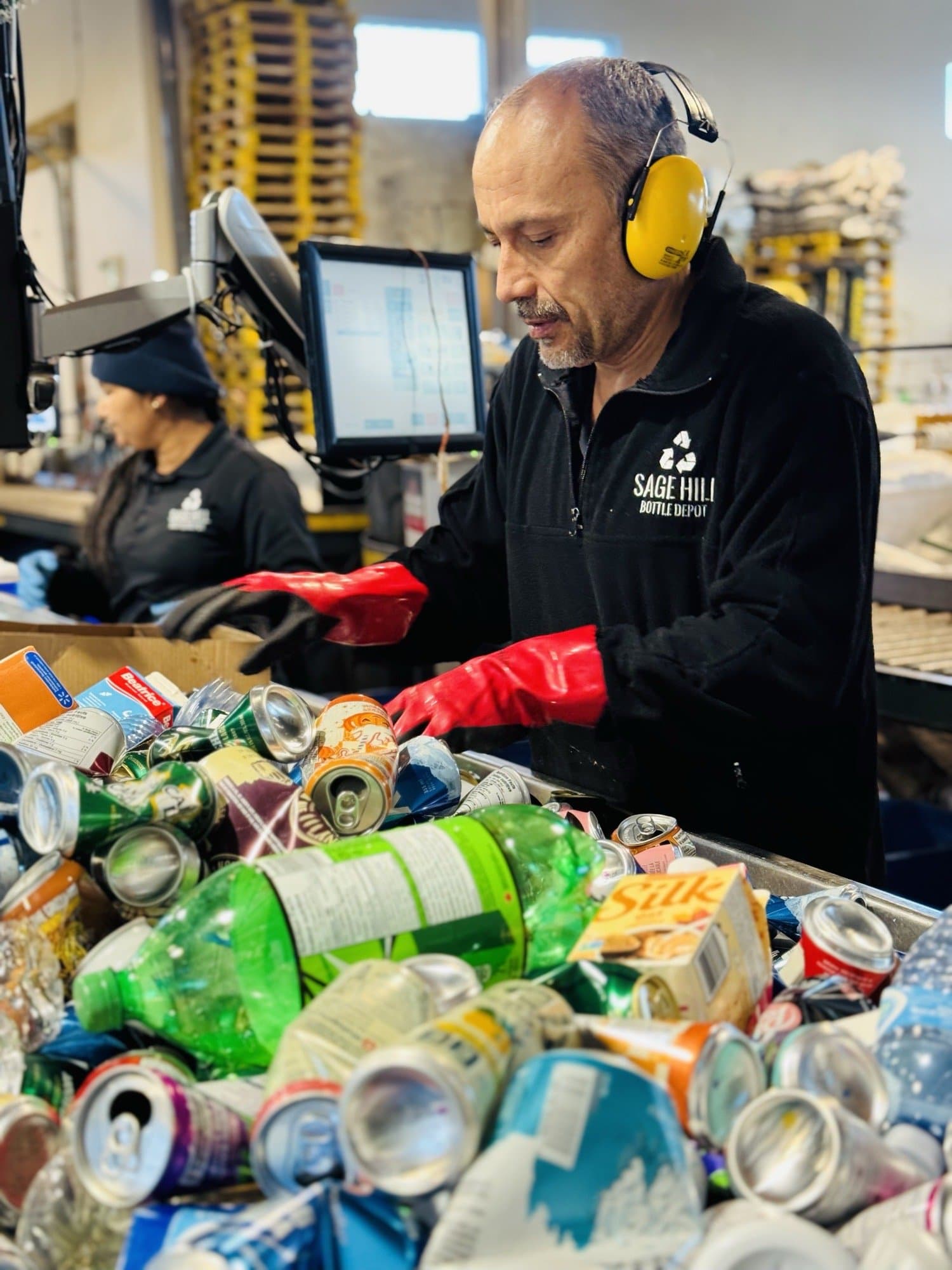 Sage Hill Bottle Depot staff sorting refundable beverage containers